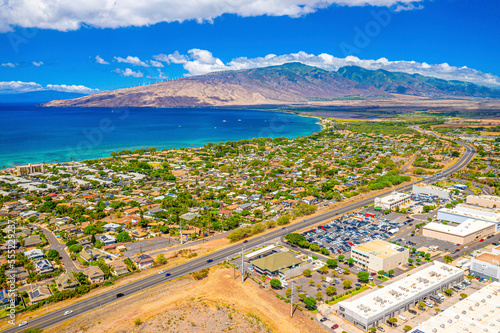 Aerial view of the town and main thoroughfare along the oceanfront of Kihei at Sugar Beach; Maui, Hawaii, United States of America photo