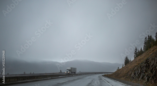 Transport truck on a highway on a rainy day, British Columbia Highway 5 (Coquihalla); British Columbia, Canada photo