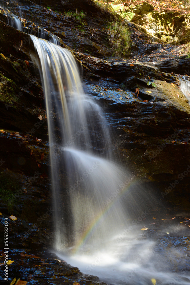 Waterfall with a rainbow in the fall.; New Hampshire, USA. Waterfall with a rainbow in the fall.; New Hampshire, USA.
