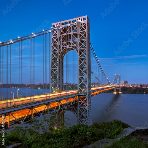 The George Washington Bridge (long-span suspension bridge) across the Hudson River in evening connecting New Jersey with Upper Manhattan, New York City