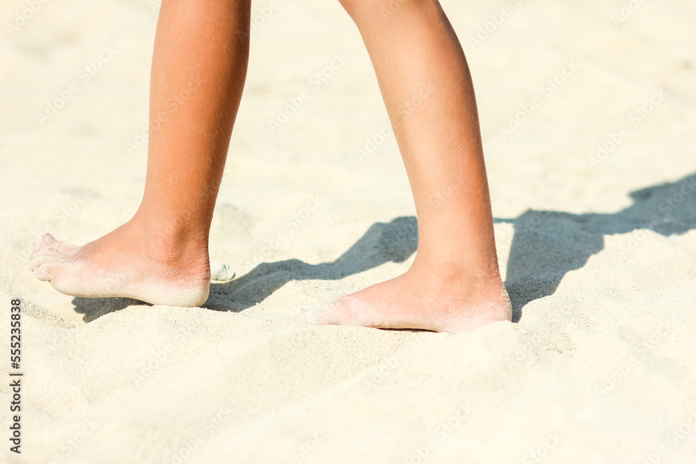 A Feet and footprints by the seashore in nature travel vacation background