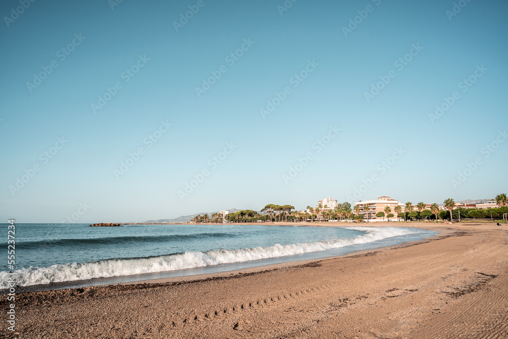 empty beach in the mediterranean sea on a sunny day