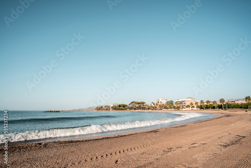 empty beach in the mediterranean sea on a sunny day