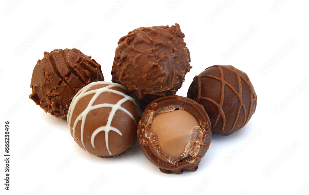 Chocolate candies collection. Beautiful Belgian truffles isolated on white background Chocolate candies collection. Beautiful Belgian truffles isolated on white background