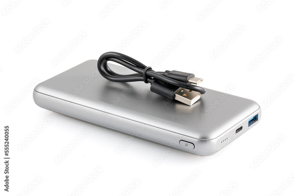 Additional autonomous power bank for charging mobile devices. External battery isolated on white background. Silver charger for a smartphone with a power supply (battery). Full depth of field. Additional autonomous power bank for charging mobile devices. External battery isolated on white background. Silver charger for a smartphone with a power supply (battery). Full depth of field.