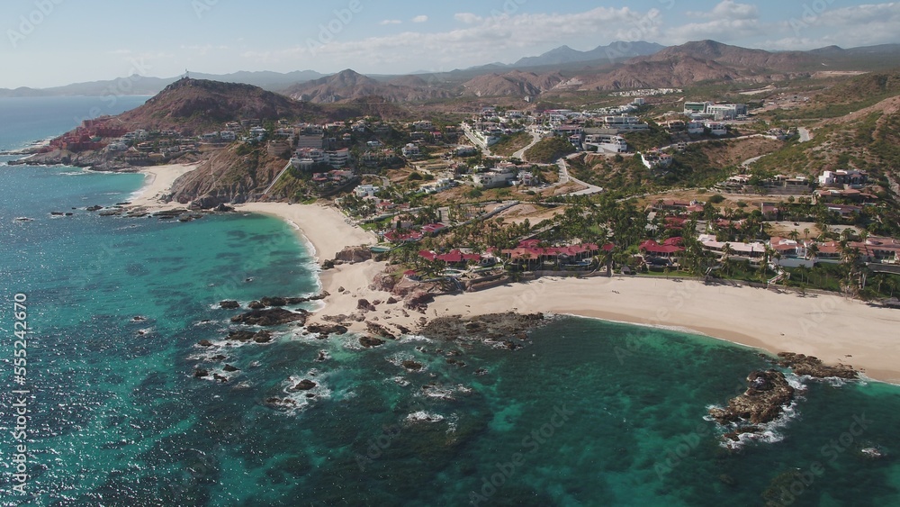 Aerial of resorts and beach front homes along shoreline in Jose Del Cabo, Mexico