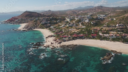 Aerial of resorts and beach front homes along shoreline in Jose Del Cabo, Mexico