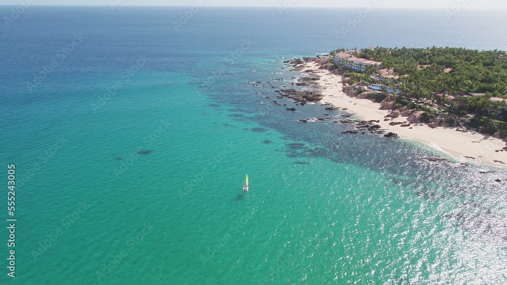 Aerial of sail boat in clear turquoise waters in Jose Del Cabo, Mexico