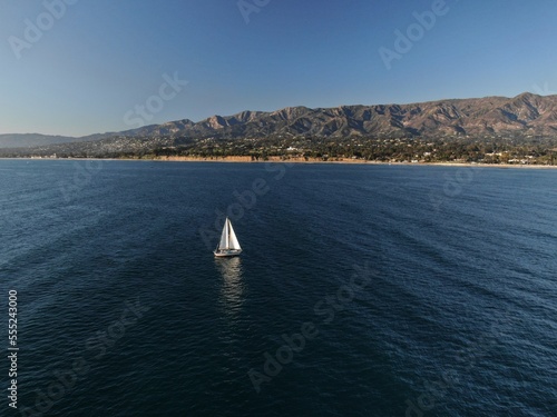 Aerial of sail boast off coast of Santa Barbara, California.