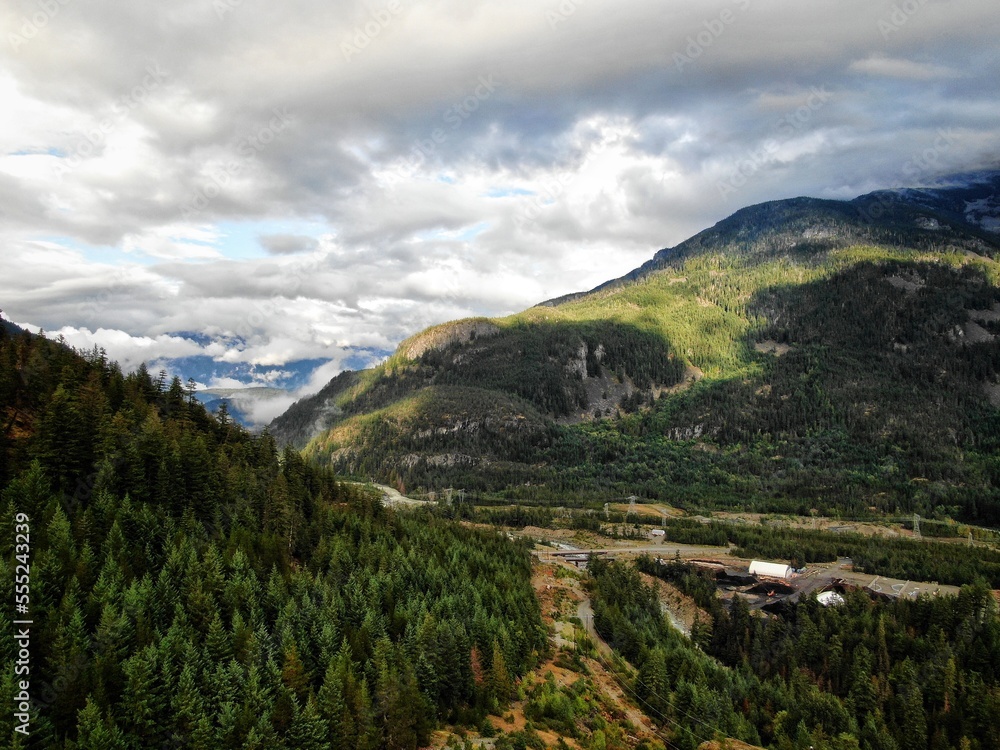 Obraz premium Aerial of Whistler mountains with low clouds