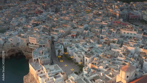 Aerial view of Polignano a mare at sunset in the province of Bari in Puglia. A country on the sea a wonderful landscape