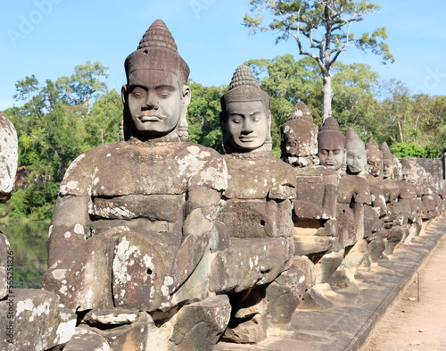 Sculptural stone group of guard soldiers at the gates of the ancient Angkor Wat is a temple complex in Cambodia