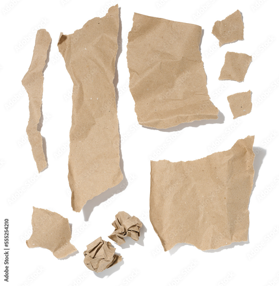 Various torn strips of brown wrapping paper on a white isolated background, top view