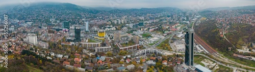 Fototapeta Naklejka Na Ścianę i Meble -  Aerial view around the capital city Sarajevo in Bosnia and Herzegovina on a cloudy and fogy day in autumn.