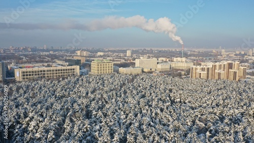 Minsk, Belarus - 01.12.2022: Panoramic view of Minsk in winter. The capital of Belarus Minsk in winter. Snowy Minsk. Chelyuskintsev Park in winter. Aerial photography of the capital of Belarus photo