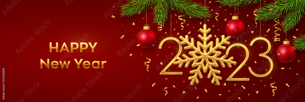 Happy New 2023 Year. Hanging Golden metallic numbers 2023 with snowflake, balls, pine branches and confetti on red background. New Year greeting card or banner template. Holiday decoration. Vector.