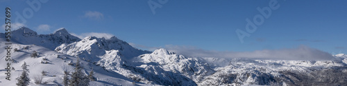 Banner 4x1 with winter mountain landscape with forest, mountain peaks, snowy slopes