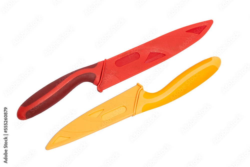 Obraz premium Two household knives isolated on a white background. One red knife and one orange knife with safety case
