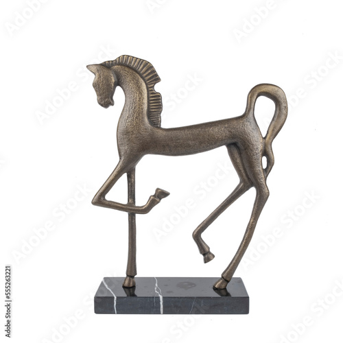 decorative ancient horse figure metal statue on marble stone isolated on white