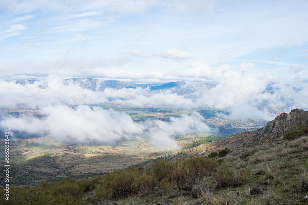 Beautiful landscape from a hill top. Low clouds over the valley Beautiful landscape from a hill top. Low clouds over the valley