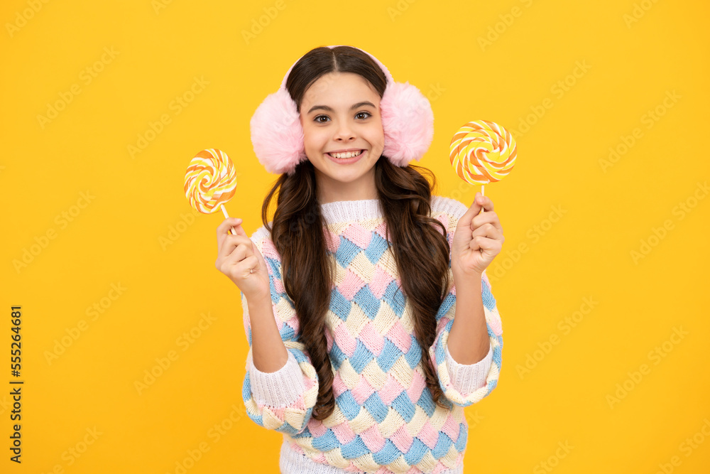 Teenage girl with candy lollipop, happy child 12, 13, 14 years old eating big sugar lollipop, sweets candy. Teenage girl with candy lollipop, happy child 12, 13, 14 years old eating big sugar lollipop, sweets candy.