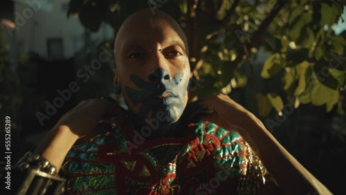 Mexica Aztec Dancer portrait putting on regalia 