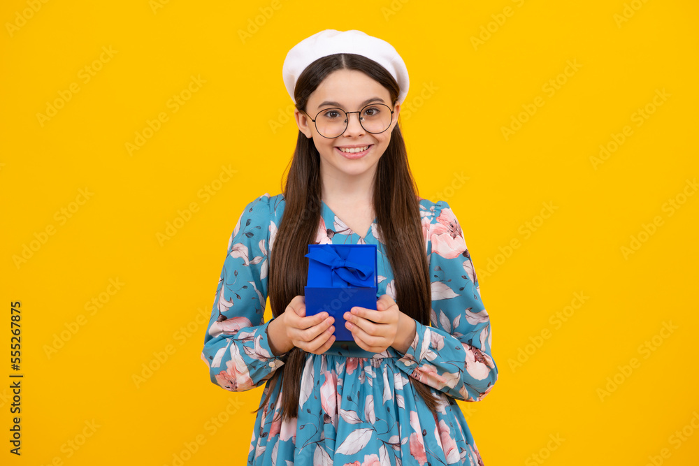 Emotional teenager child hold gift on birthday. Funny kid girl holding gift boxes celebrating happy New Year or Christmas. Emotional teenager child hold gift on birthday. Funny kid girl holding gift boxes celebrating happy New Year or Christmas.