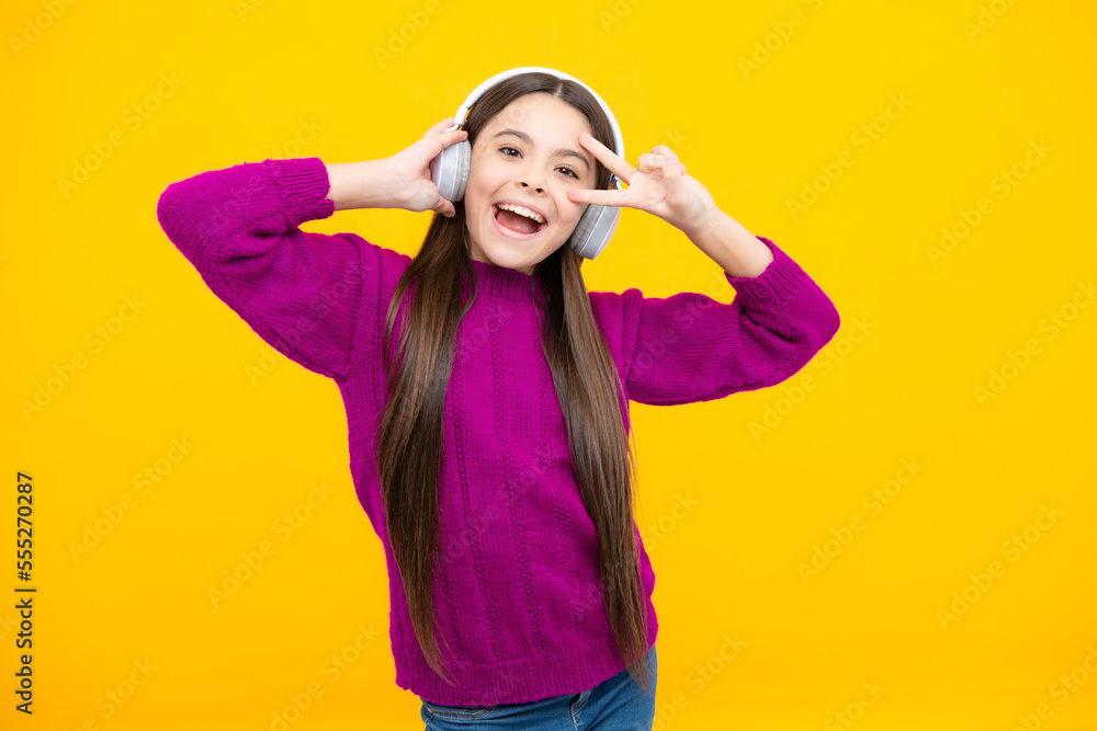 Excited face. Funny kid girl 12, 13, 14 years old listen music with headphones. Teenage girl with headphones listening songs on headset earphone. Amazed expression, cheerful and glad. Excited face. Funny kid girl 12, 13, 14 years old listen music with headphones. Teenage girl with headphones listening songs on headset earphone. Amazed expression, cheerful and glad.