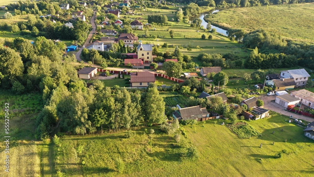 Leshnitsa village, Minsk region, Belarus - 20.08.2022: Aerial view of the modern Belarusian village of Leshnitsa on the Svisloch River near Minsk. Village in Eastern Europe. Russian village