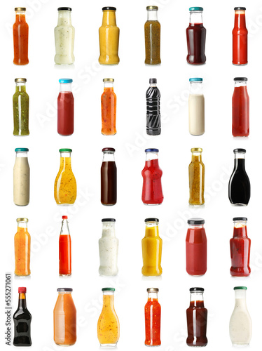 Collage of tasty sauces in bottles on white background