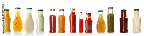 Collection of delicious sauces in bottles on white background