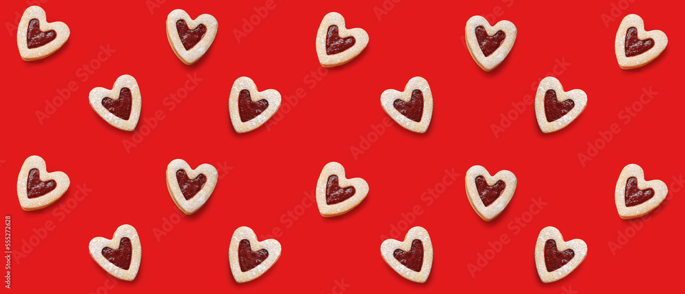 Many tasty cookies in shape of hearts on red background. Pattern for Valentine's Day Many tasty cookies in shape of hearts on red background. Pattern for Valentine's Day