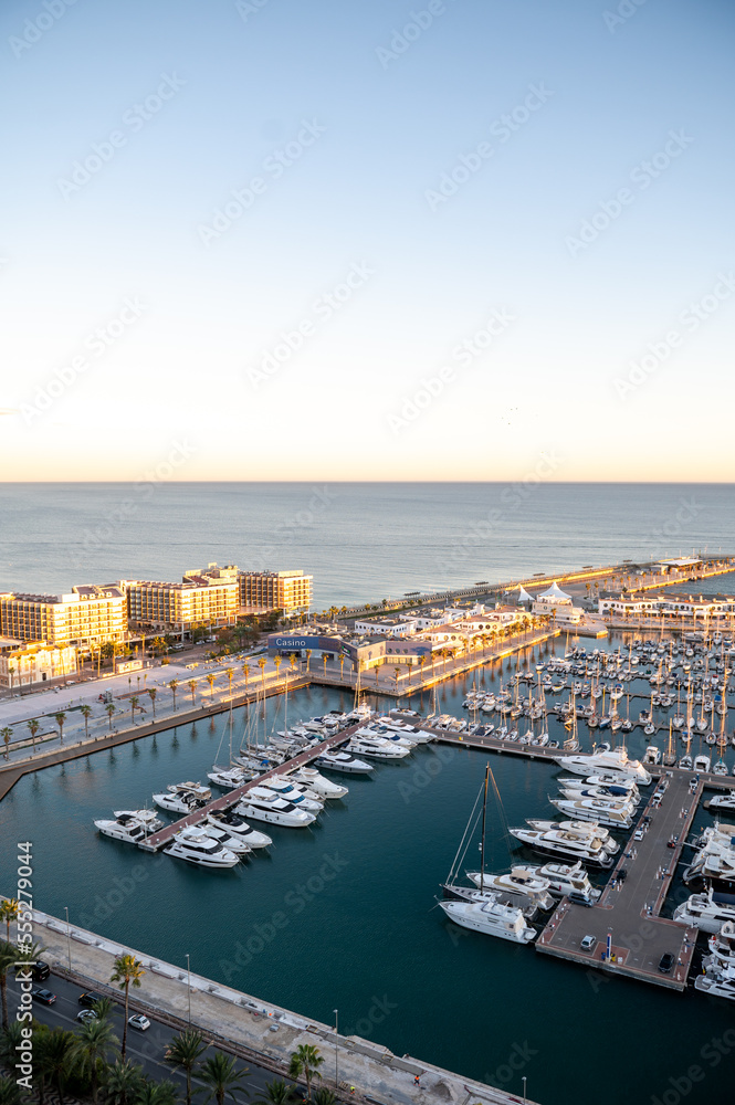 People walking on the Paseo Maritimo in the touristic city of Alicante in Spain in 2022.
