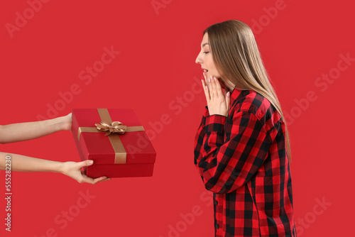 Young woman in pajamas rece...