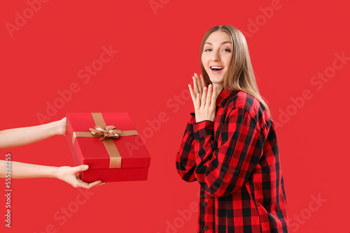 Young woman in pajamas rece...