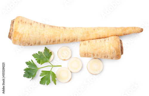 Whole and cut raw parsley roots, fresh herb isolated on white, top view