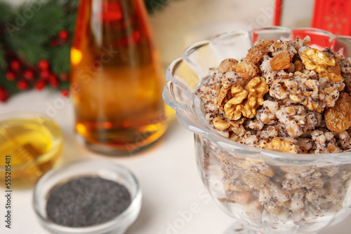 Glass bowl of Kutya on white table, closeup