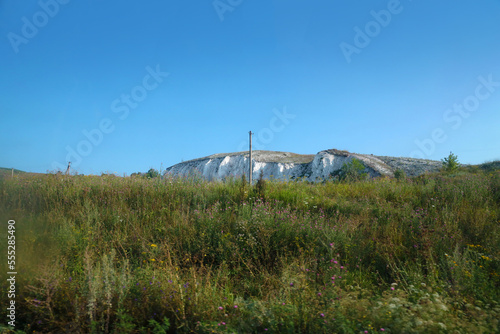 Ancient multimillion chalk mountains on the steppe surface of earth. White chalk mountains in the Dvurechansky park reserve in Ukraine photo