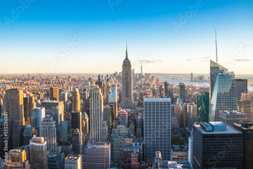 Panoramic view of The Empire State Building, Manhattan downtown and skyscrapers at sunset. © Itza