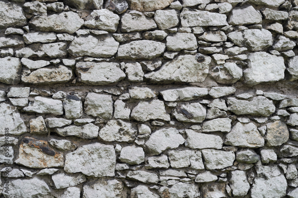 Fototapeta premium stone masonry grey wall background. stone masonry grey wall backdrop. background stone masonry