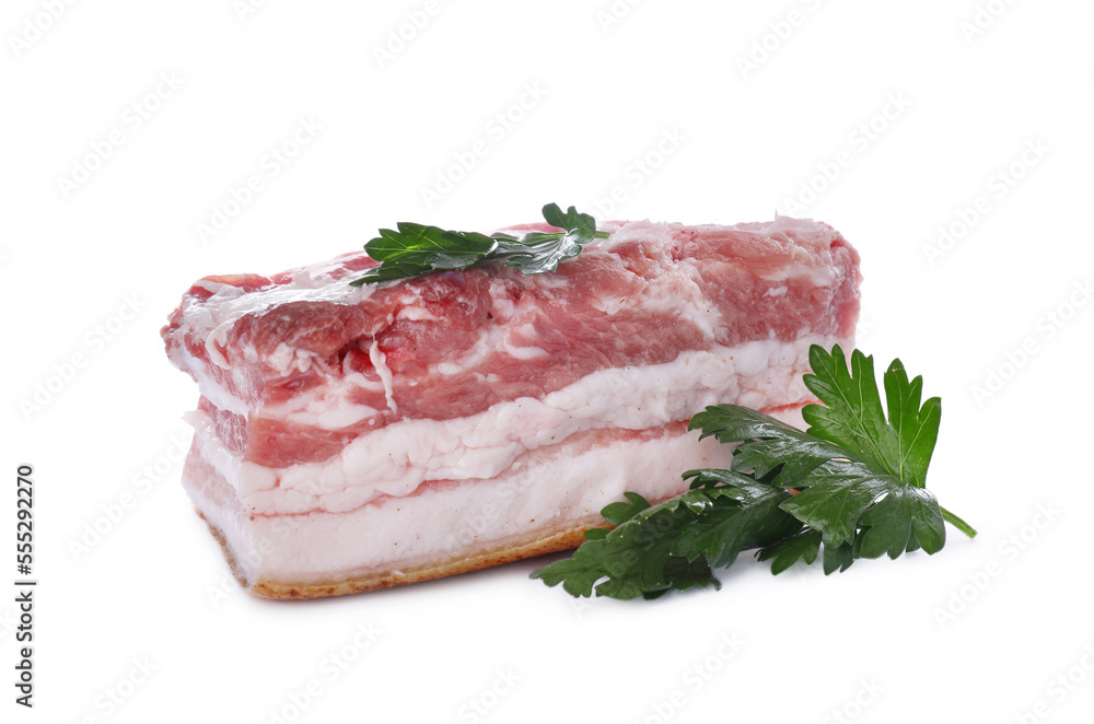 Piece of pork fatback and parsley isolated on white