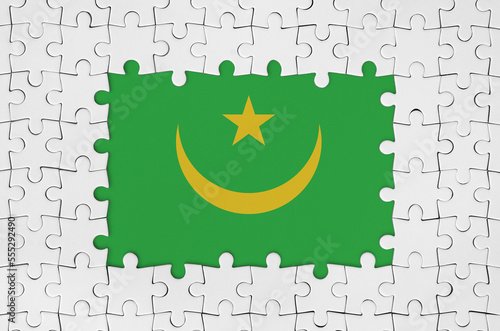 Mauritania flag in frame of white puzzle pieces with missing central parts photo
