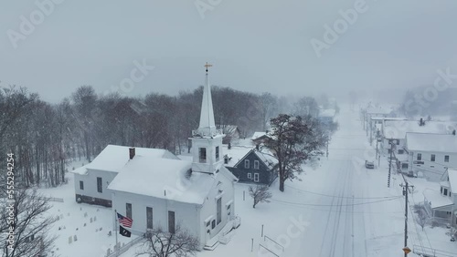 Heavy snowfall surrounds Monson community church photo