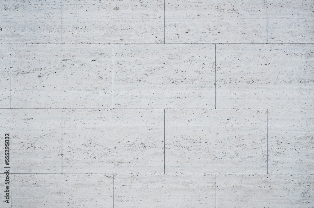 Naklejka premium Limestone wall texture background. Classic gray white travertine texture for design. 