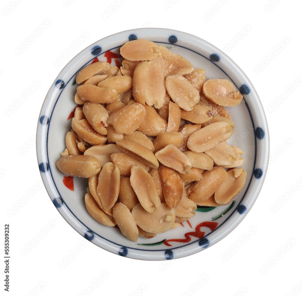 Fototapeta premium Peanuts in a cup on wooden background