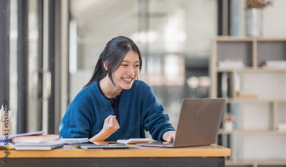 Image of a happy excited young entrepreneur Asian woman in workplace, winner, feel excited, Happy, joyful, Surprised and business finance concept. Image of a happy excited young entrepreneur Asian woman in workplace, winner, feel excited, Happy, joyful, Surprised and business finance concept.