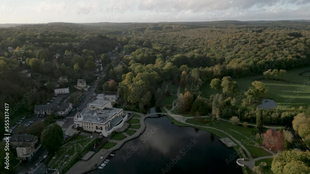 Lac de Bagnoles de l'Orne, small lake on edge of Andaines forest, Normandy in France. Aerial forward tilt-up reveal Lac de Bagnoles de l'Orne, small lake on edge of Andaines forest, Normandy in France. Aerial forward tilt-up reveal