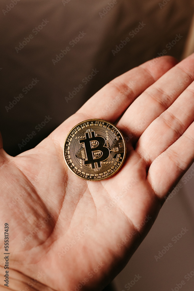 hands holding golden cryptocurrencies hands holding golden cryptocurrencies