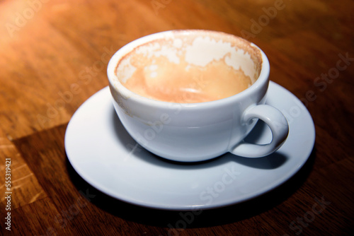 cup of coffee on wooden table