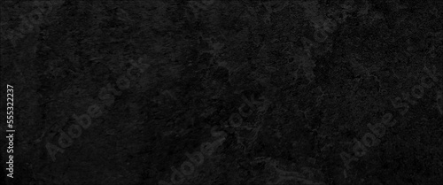 Black stone background. Free space for your text. Top view, Free space for your text, dark stone background, stone texture, black or dark gray rough grainy stone texture background.
